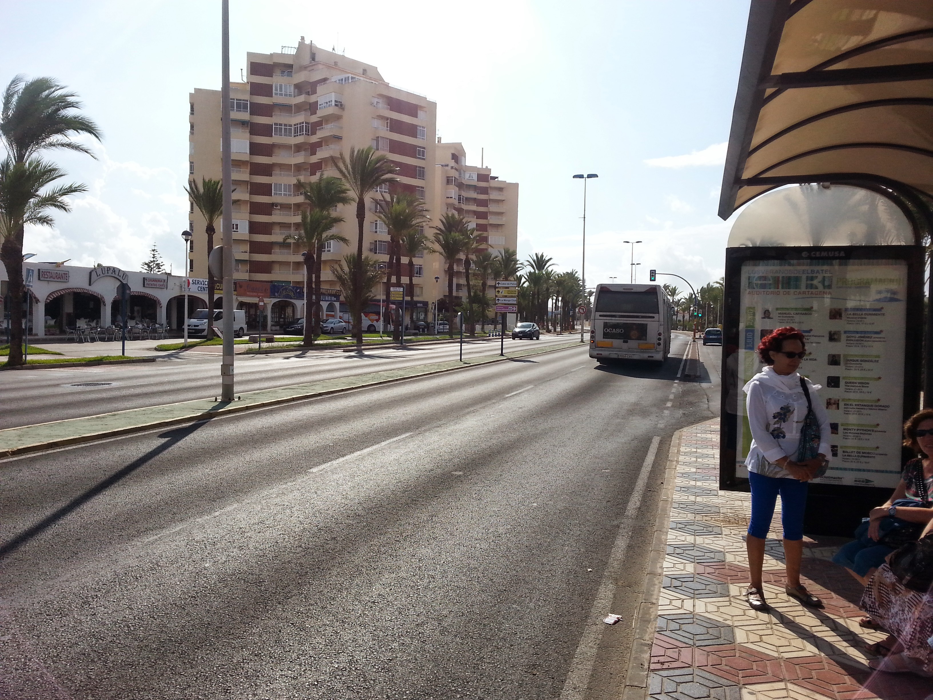 A bus drives down La Manga strip
